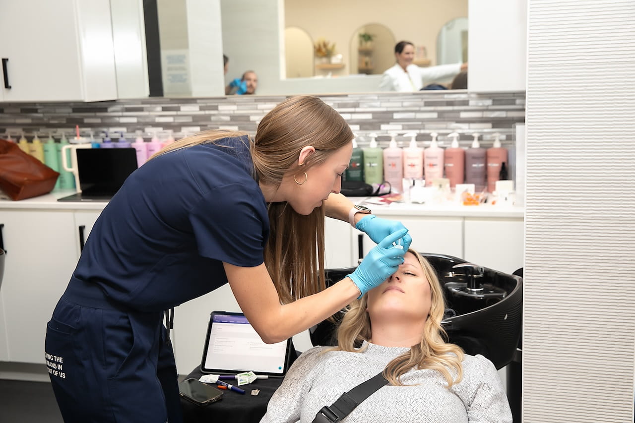 performing botox injection