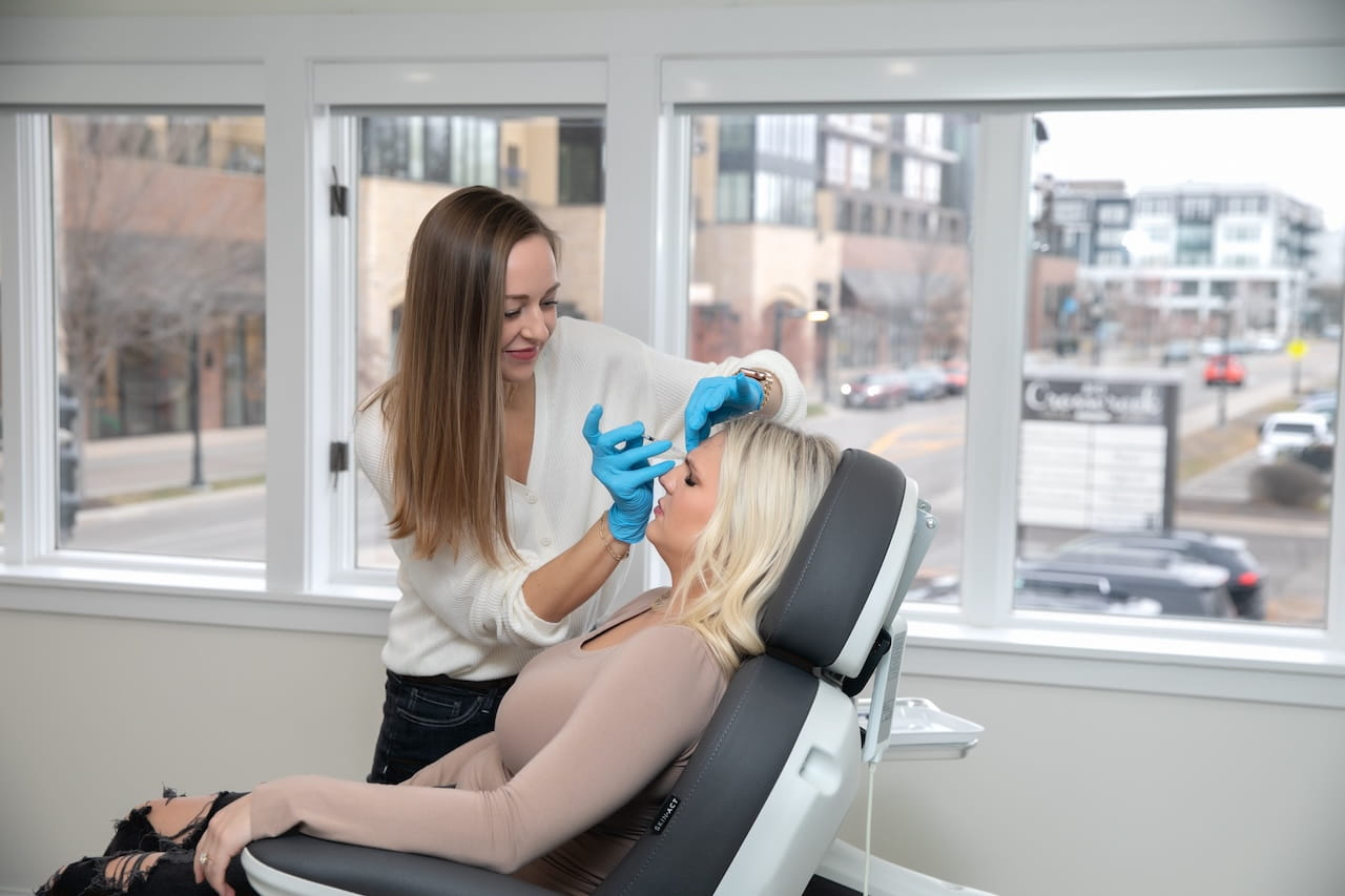 injection specialist injecting botox on patient